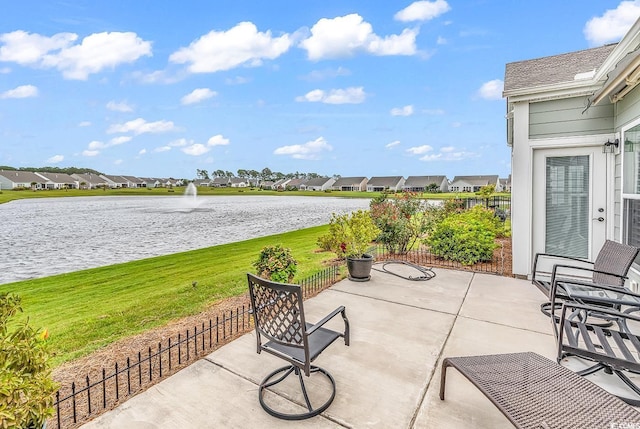 view of patio featuring a water view