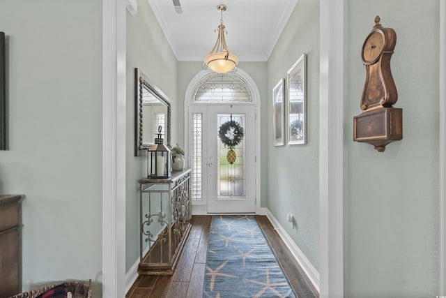 entryway with dark hardwood / wood-style floors and crown molding