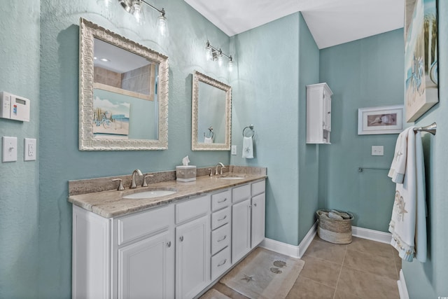 bathroom with tile patterned floors and double sink vanity