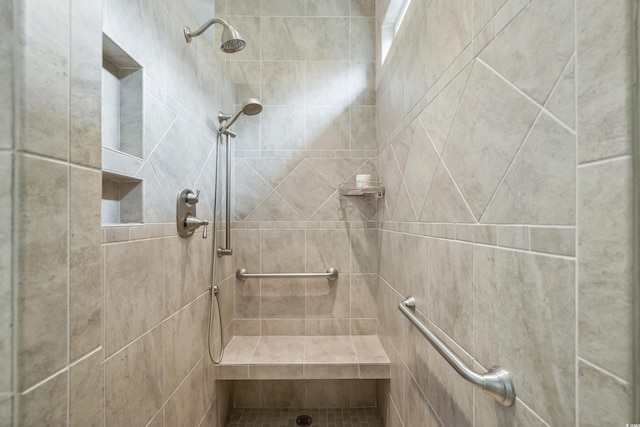 bathroom featuring tiled shower