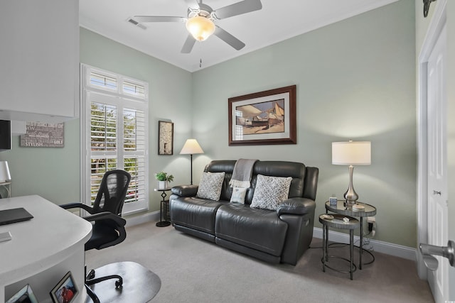 home office featuring carpet, ornamental molding, and ceiling fan