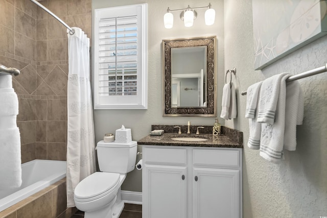 full bathroom with vanity, tile patterned floors, toilet, and shower / bath combination with curtain