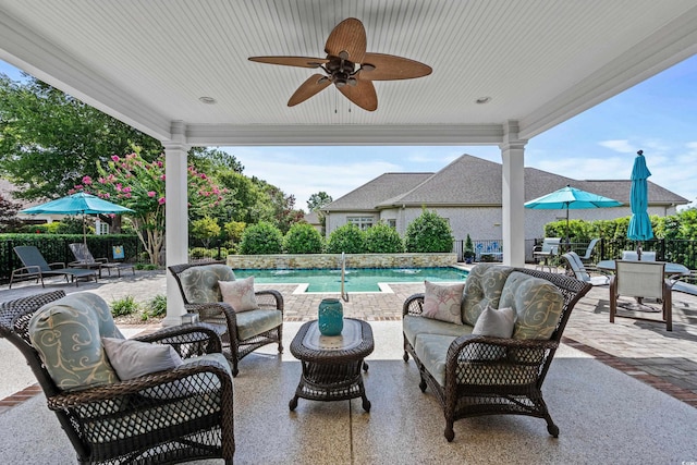 view of patio with pool water feature, outdoor lounge area, and ceiling fan