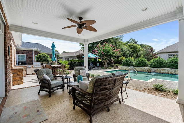 view of patio / terrace with grilling area, an outdoor living space, and ceiling fan