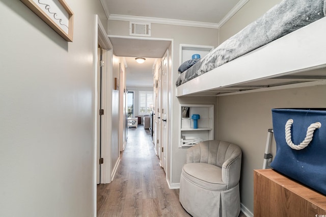 corridor featuring crown molding and wood-type flooring