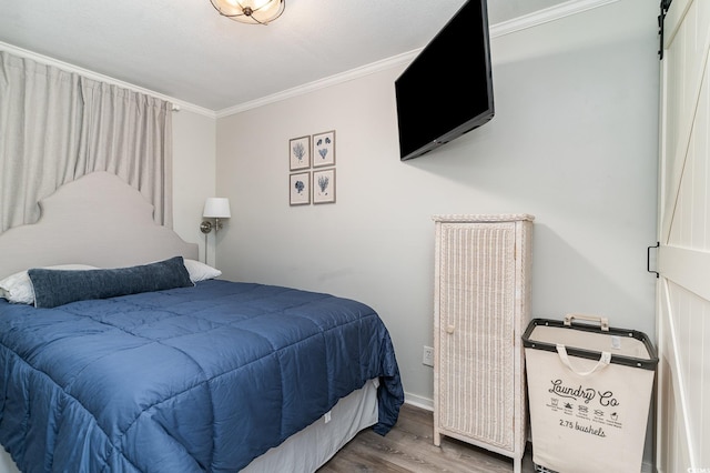 bedroom featuring ornamental molding and wood-type flooring