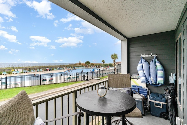 balcony featuring a water view