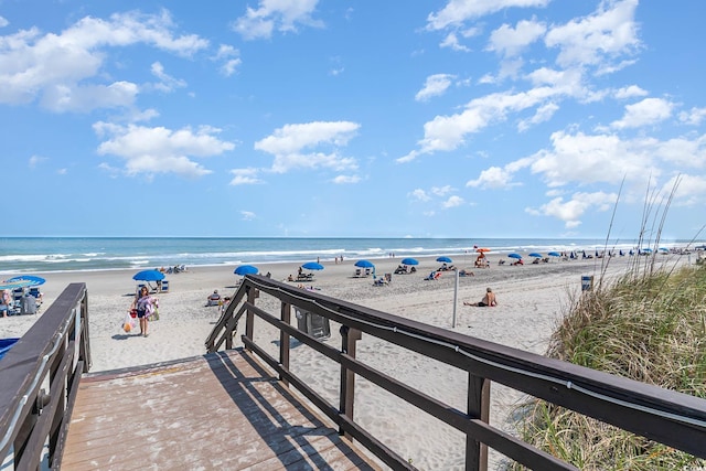 property view of water featuring a beach view