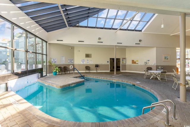 view of swimming pool featuring a skylight