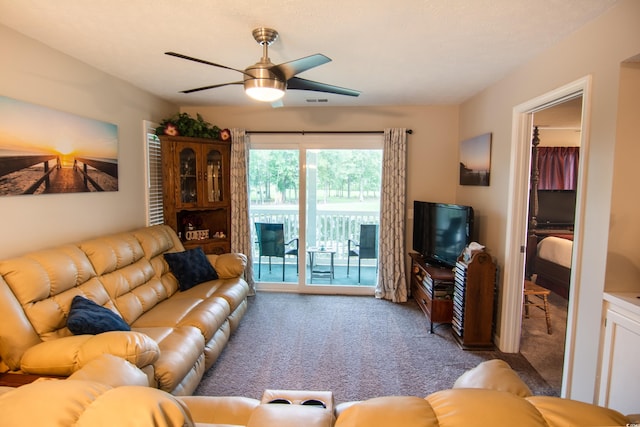 carpeted living room featuring ceiling fan