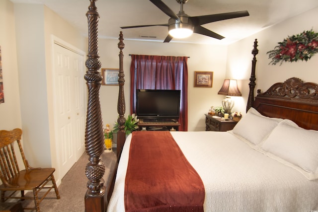 bedroom featuring ceiling fan, a closet, visible vents, and carpet flooring