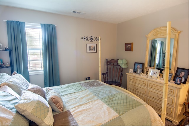 bedroom with multiple windows