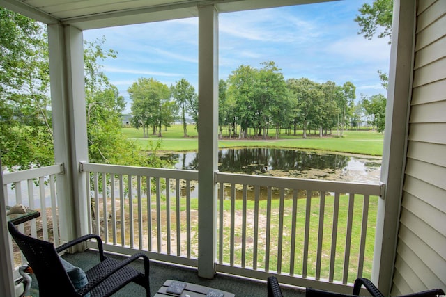 balcony featuring a water view