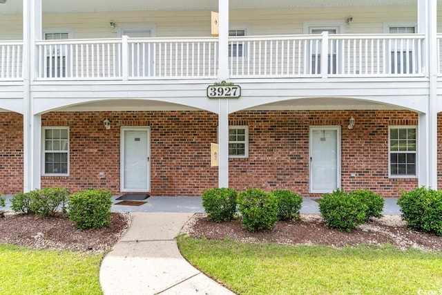 property entrance with a balcony