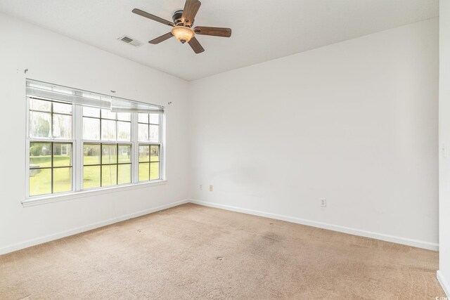 empty room with light carpet and ceiling fan