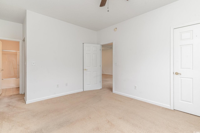 unfurnished bedroom featuring ceiling fan and light colored carpet