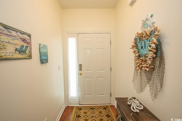 doorway to outside with hardwood / wood-style flooring