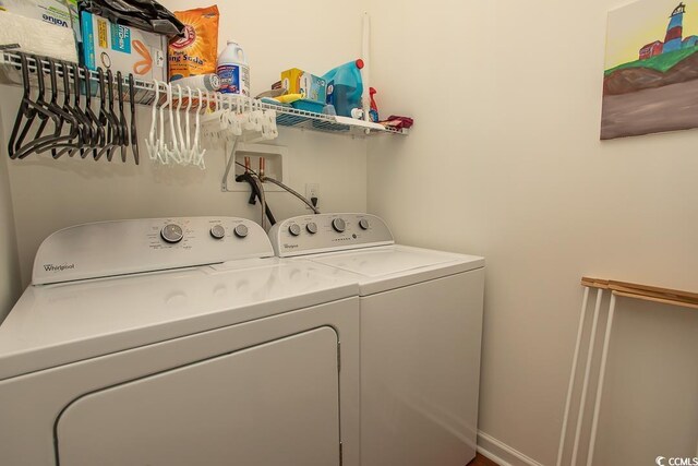 laundry room with washing machine and clothes dryer