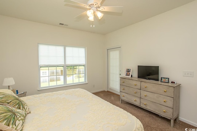 bedroom with ceiling fan and dark carpet