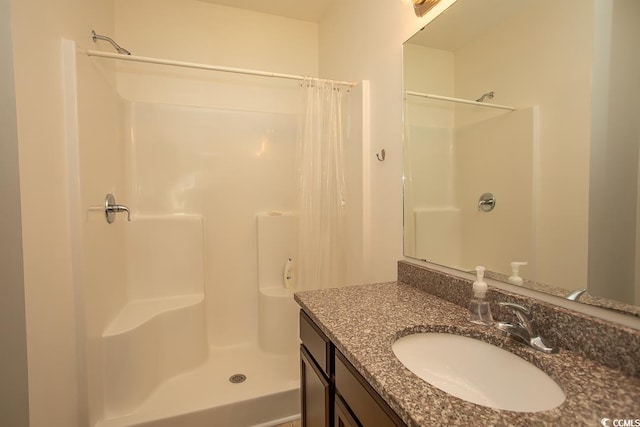 bathroom featuring vanity and walk in shower