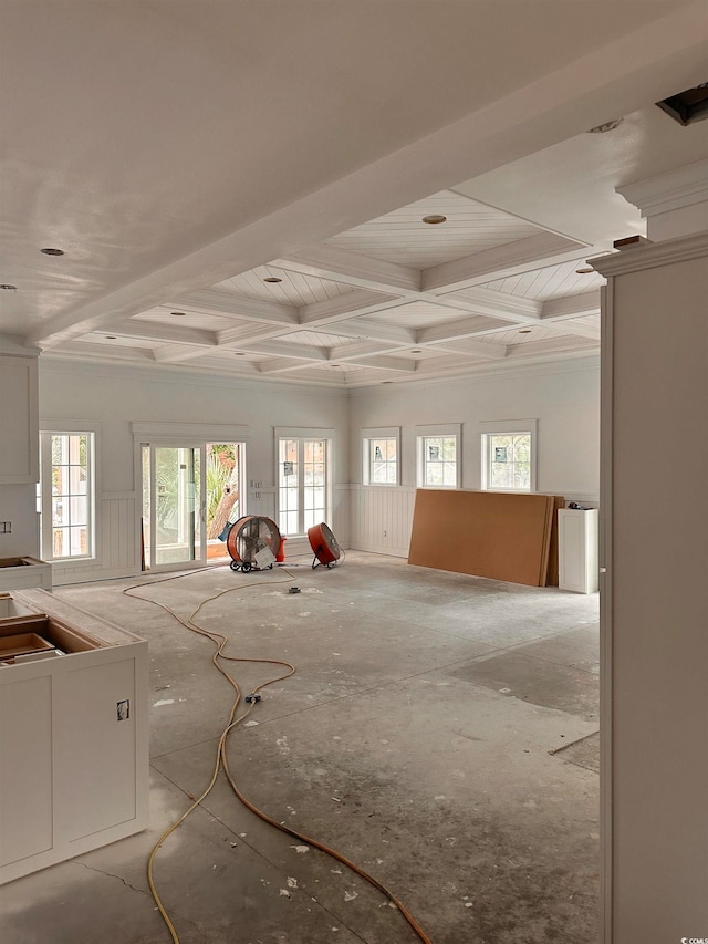 unfurnished room featuring a wealth of natural light and coffered ceiling