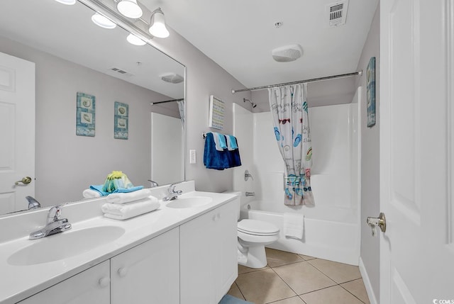 full bath featuring shower / bath combination with curtain, tile patterned flooring, a sink, and toilet