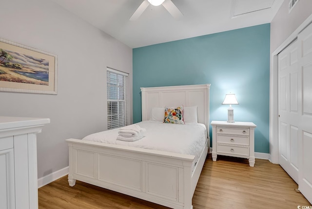 bedroom featuring light wood-style floors, ceiling fan, and baseboards