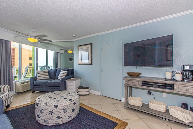 tiled living room featuring a textured ceiling, ceiling fan, and crown molding