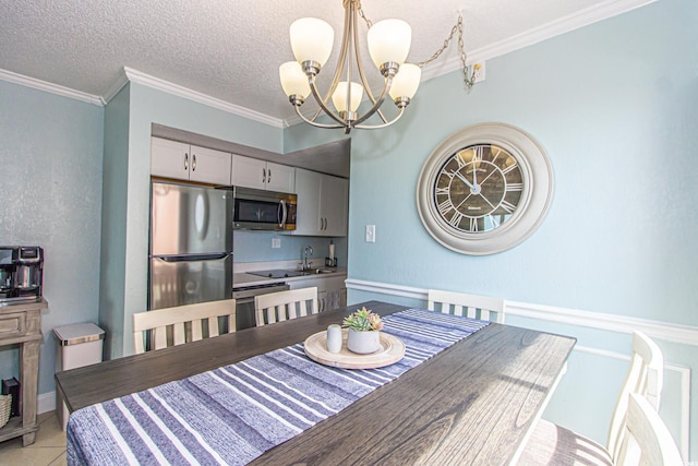 dining space featuring a textured ceiling, crown molding, and a chandelier