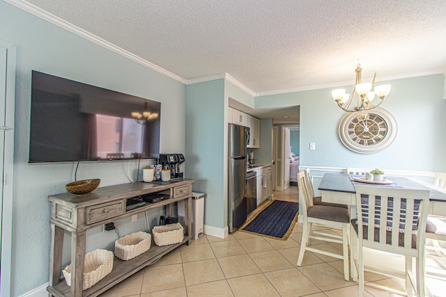 dining space featuring a chandelier, a textured ceiling, light tile patterned floors, and crown molding