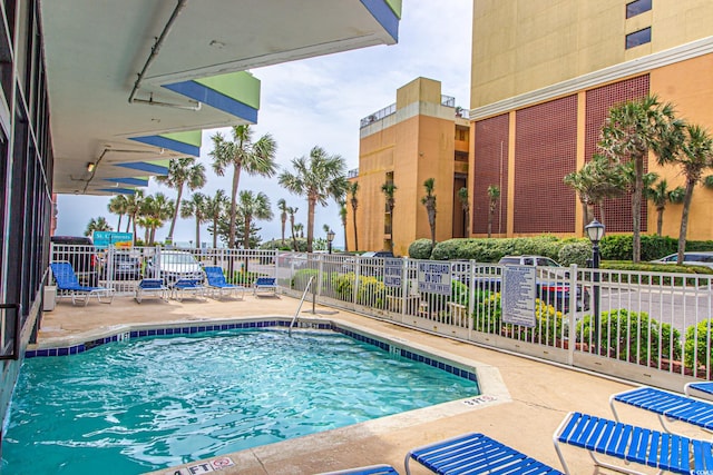 view of swimming pool featuring a patio