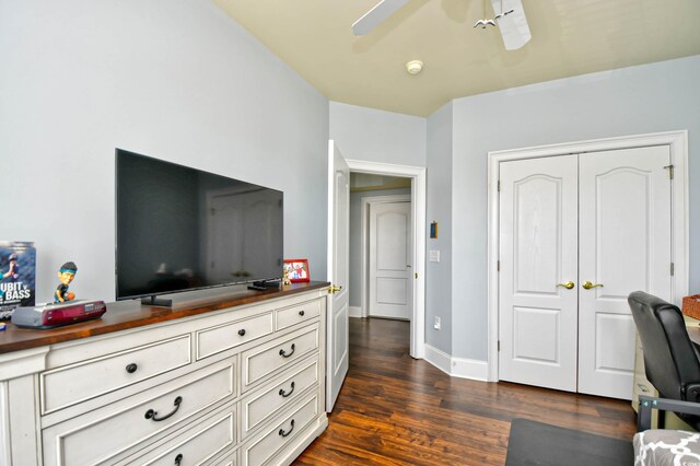 bedroom featuring a closet, ceiling fan, and dark wood-type flooring