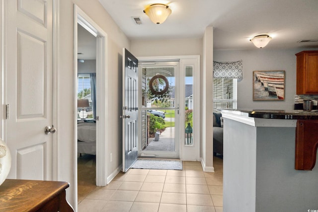 entrance foyer featuring light tile patterned floors