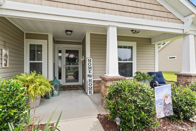 doorway to property featuring covered porch