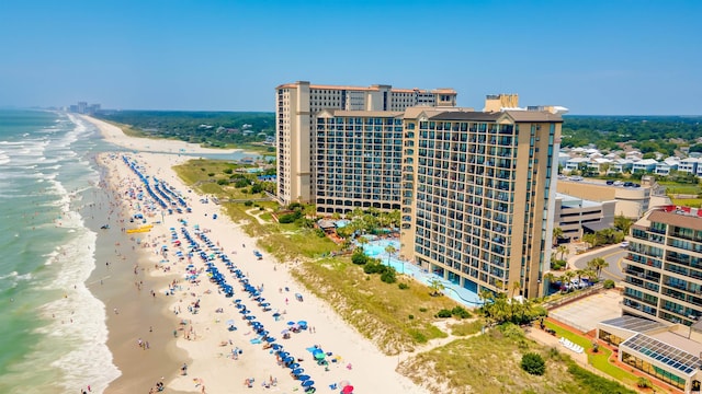 drone / aerial view with a water view and a view of the beach