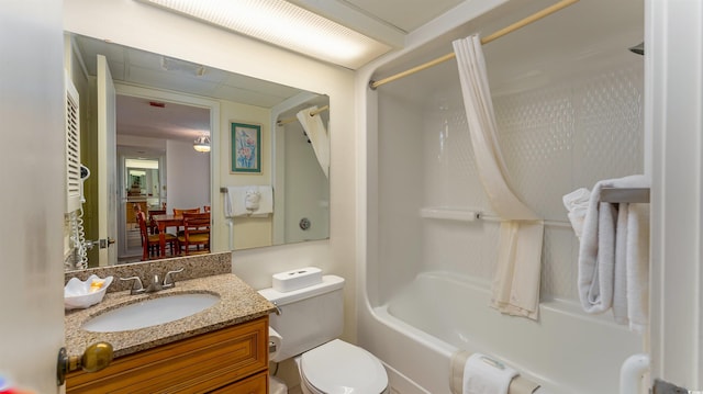 full bathroom with shower / tub combo, vanity, and toilet