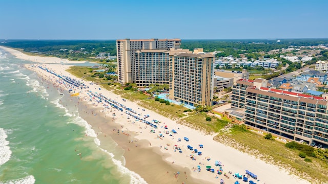 bird's eye view featuring a water view and a view of the beach