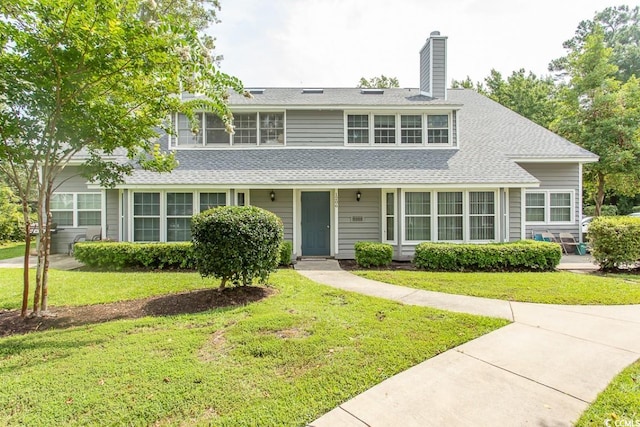 view of property featuring a front yard