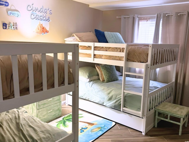 bedroom with wood finished floors