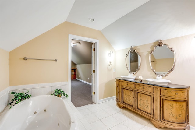 5414 Hampton Rd, Conway, SC 29527 - bathroom featuring vaulted ceiling, a tub with jets, and double vanity