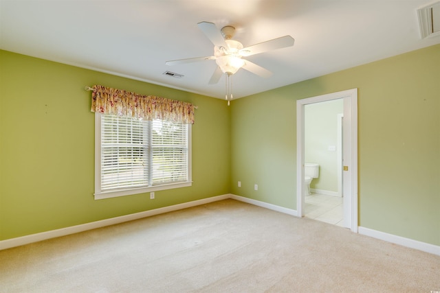 unfurnished room with light carpet and ceiling fan