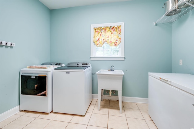 5414 Hampton Rd, Conway, SC 29527 - laundry area featuring washer and clothes dryer, baseboards, and light tile patterned floors