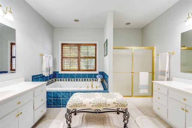 bathroom with tile patterned floors, vanity, and separate shower and tub