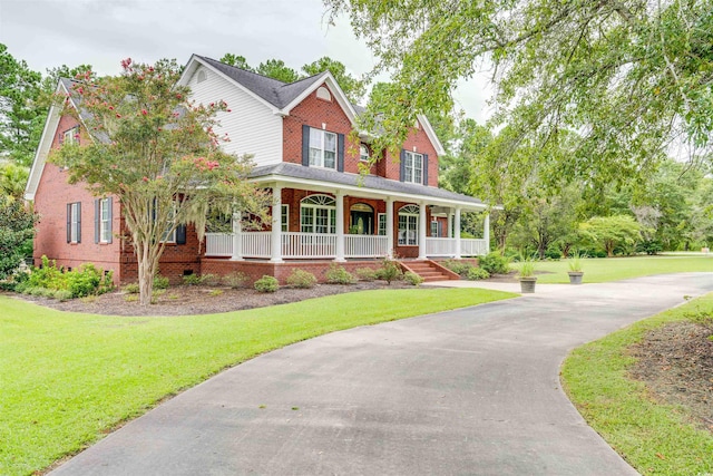 5414 Hampton Rd, Conway, SC 29527 - view of front facade featuring a porch, brick siding, and a front yard