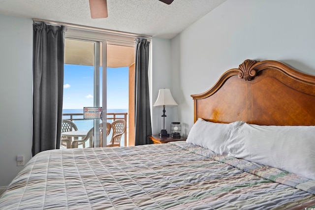 1321 S Ocean Blvd Unit 606, North Myrtle Beach, SC 29582 - bedroom featuring a textured ceiling, a water view, ceiling fan, and access to exterior