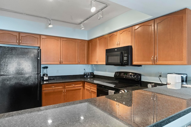 1321 S Ocean Blvd Unit 606, North Myrtle Beach, SC 29582 - kitchen featuring black appliances and dark stone countertops