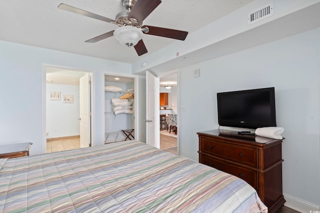 1321 S Ocean Blvd Unit 606, North Myrtle Beach, SC 29582 - bedroom with ceiling fan and a textured ceiling