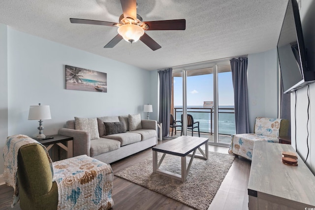 1321 S Ocean Blvd Unit 606, North Myrtle Beach, SC 29582 - living room with a textured ceiling, wood finished floors, and a ceiling fan