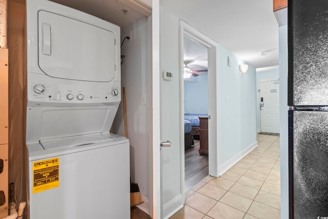 1321 S Ocean Blvd Unit 606, North Myrtle Beach, SC 29582 - laundry area featuring stacked washer / drying machine, light tile patterned flooring, and a ceiling fan