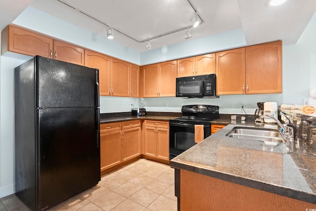 1321 S Ocean Blvd Unit 606, North Myrtle Beach, SC 29582 - kitchen with black appliances, dark countertops, and light tile patterned floors